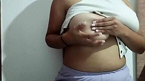 This milf indulges in massaging her big natural tits with real homemade pleasure, focusing on every sensual touch.