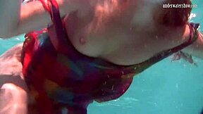 uh, redhead b nikita vodorezova strips naked real quick underwater at the beach or pool... like super fast ya know?