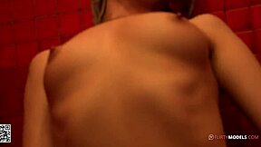 Young blond girl enjoys some fun masturbating under the shower