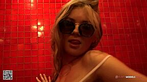 Young blond girl enjoys some fun masturbating under the shower