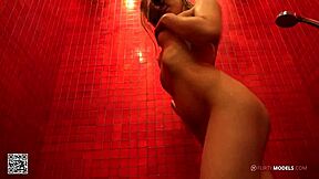 Young blond girl enjoys some fun masturbating under the shower