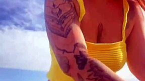 Hey, check out this young exhibitionist flashing her puffy pussy lips in bikini at the beach