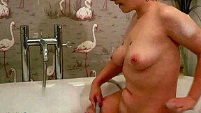 Curvy British redhead teen strips lingerie for wild dildo orgasm in steamy bath!