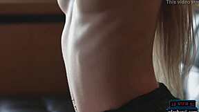 This tiny Russian teen blonde does a hot striptease in clothes that get ripped while posing with her shaved pussy