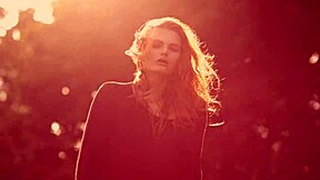 czech teen shows off her young tits in a glamorous outdoor wind-swept video scene