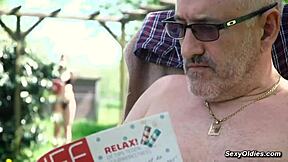 Teen neighbor teases old man into outdoor sex in his backyard garden.