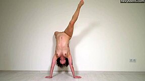 Curly-Haired Russian Gymnast Stretches Naked on Sofa with Flexible Legs