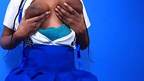 Hey check out this cute young busty babe with gigantic black nipples squeezing her natural tits after class