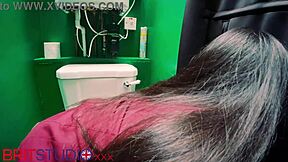 in a secretive booth, the young student encountered an anonymous encounter through the gloryhole, nervously exploring her first time with curiosity and hesitation