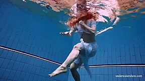 redhead marketa teases in white dress by the pool