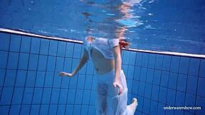 redhead marketa teases in white dress by the pool