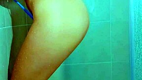 College beauty's Brazilian thong shower tease shows shaved pussy and big ass in homemade video