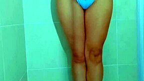 College beauty's Brazilian thong shower tease shows shaved pussy and big ass in homemade video