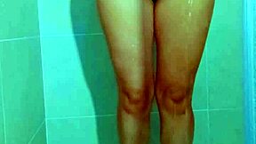 College beauty's Brazilian thong shower tease shows shaved pussy and big ass in homemade video