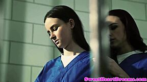 two lesbian cellmates get intimate in their cell, scissoring pussies and exploring each other's bodies with passion