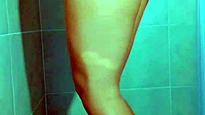 College beauty's Brazilian thong shower tease shows shaved pussy and big ass in homemade video