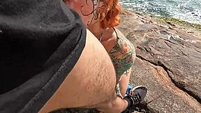 In a deserted beach, naughty girls engage in a hot orgy with kissing and cunilingus.