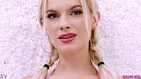 Radiant blonde girl showcases her sexy body during a casting interview on the sofa