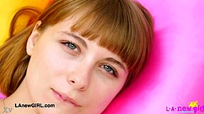 Attractive young woman poses to display her elegant figure during a casual photoshoot session