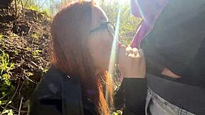 ginger beauty with red hair delivers an extreme public blowjob in the woods to a stranger