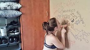 Tattooed brunette babe with big pussy lips sucks and fucks cock through gloryhole in amateur session