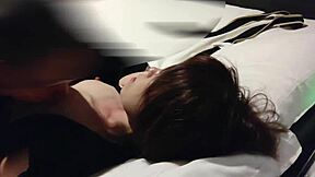 subtle hints of this cute asian couple in bed with japanese maid uniform kissing and foot fetish licking