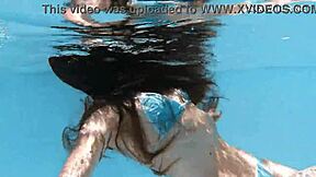 Skinny Hungarian teen Lana swims pool underwater showing juicy ass and small tits