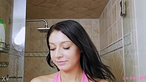 brunette fashion model steps into steamy shower after photoshoot