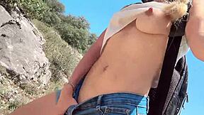 Cute college blonde strips naked in jungle showing natural tits and ass