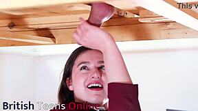 Naughty brunette in uniform milks cock at table teasingly