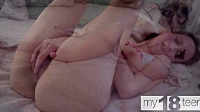 Pretty long-haired teen fingers her beautiful natural tits pussy