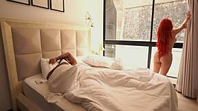 muscular guy spanks busty redhead lover's huge tits to start the morning