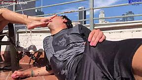 Erotique fetish patio threesome heats up barefoot. Two amateurs footjob Eric John's huge cock wet